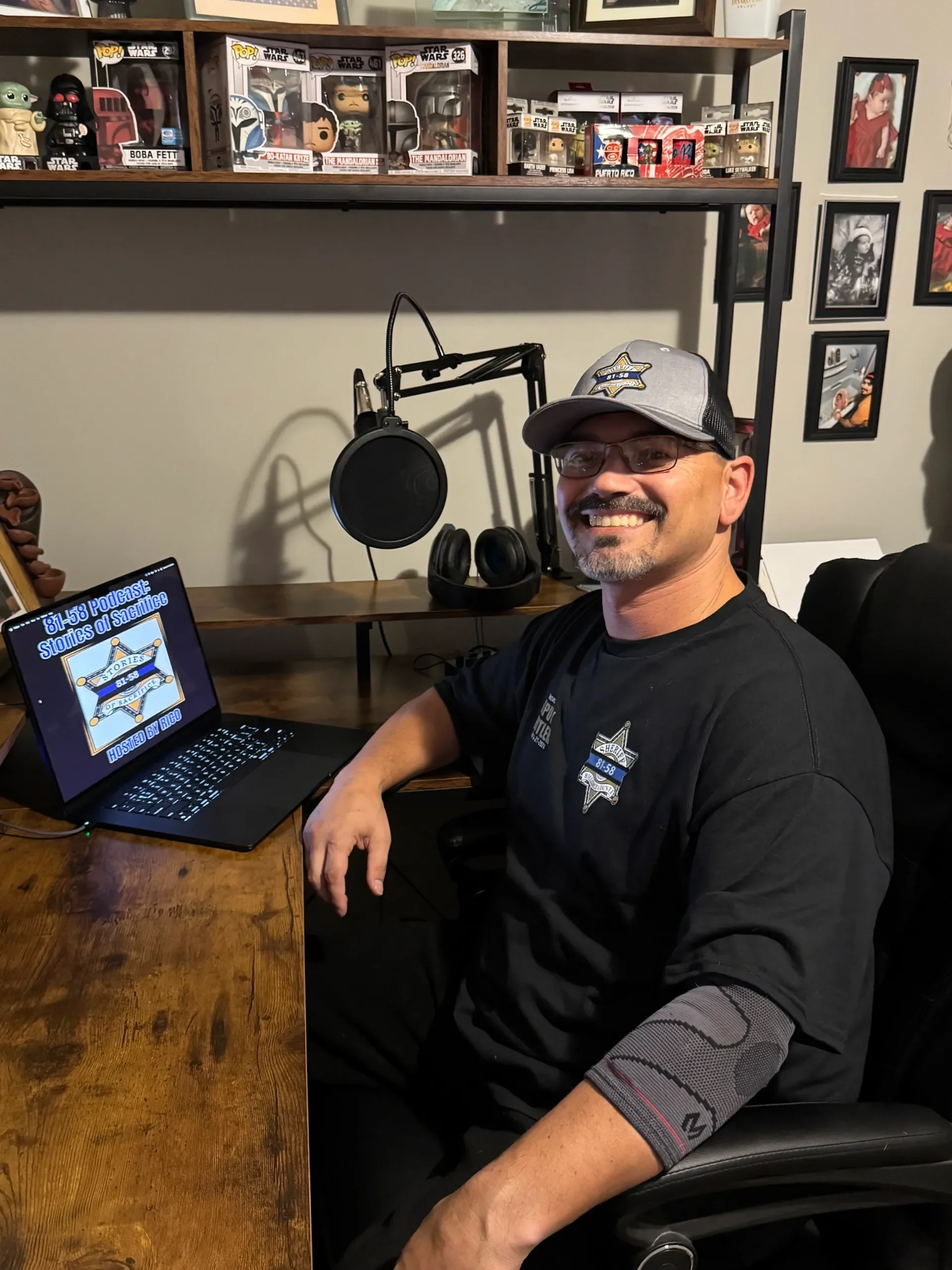 Rico Lopez, host of 8158 Podcast, at his podcast microphone